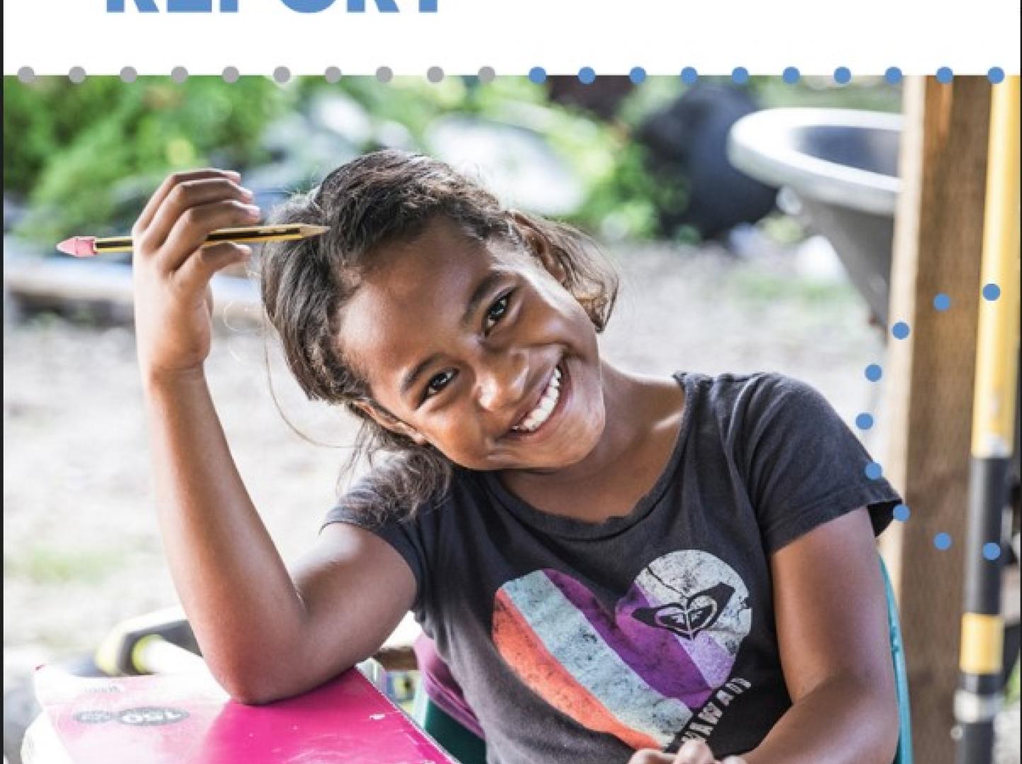 A Kiribati girl smiles at the camera