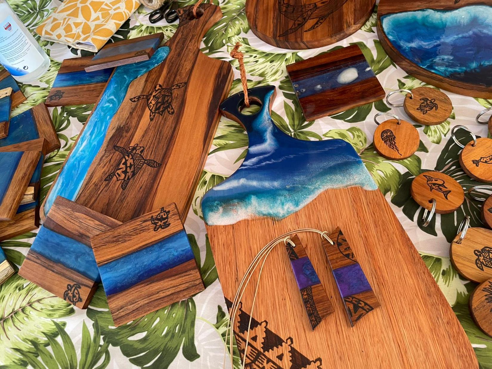 Caption: The talented Crissy Pickering's handmade wooden handicrafts were a crowd favourite at the 'mini market' day in Suva, Fiji.