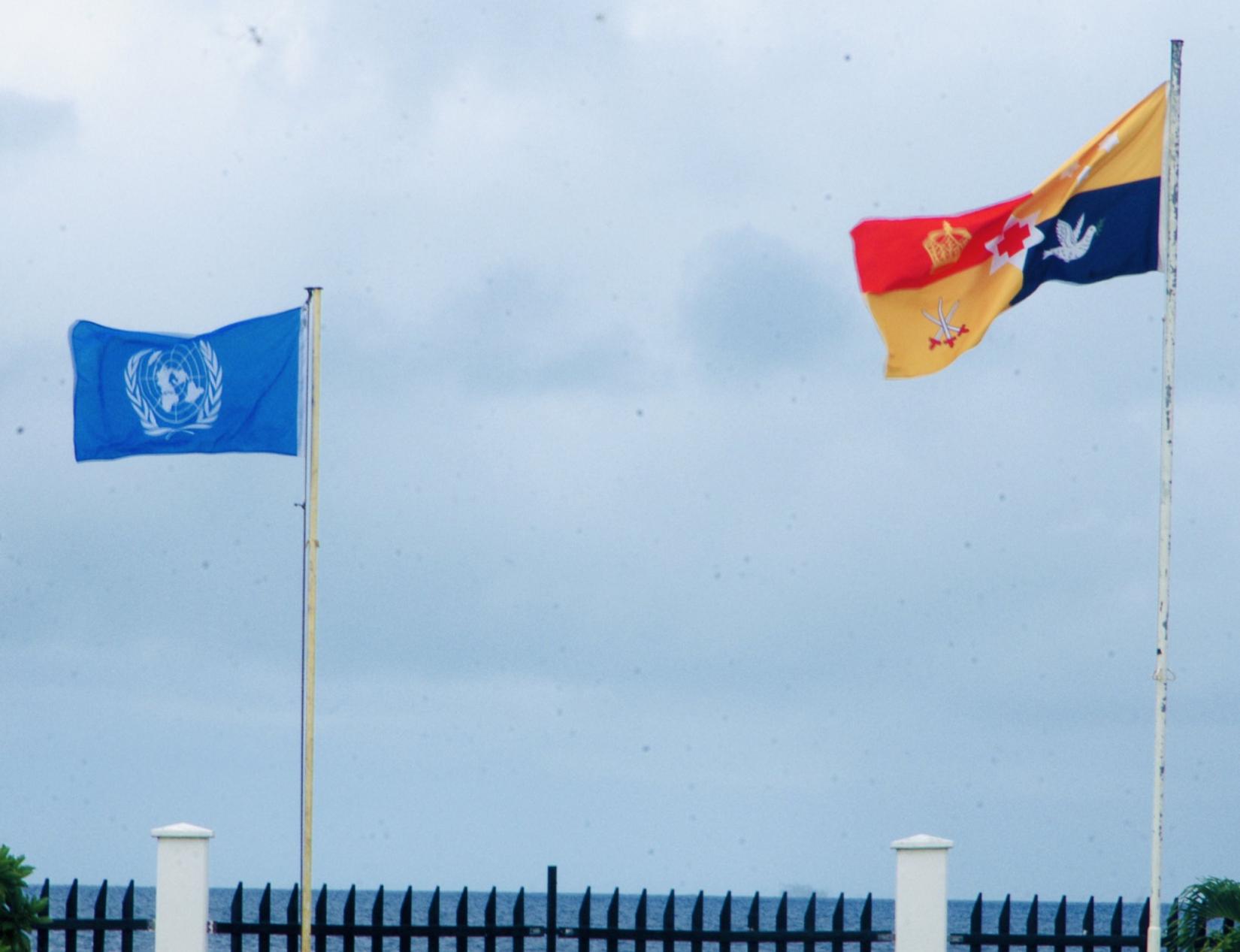 UN and Tongan flags fly side by side 