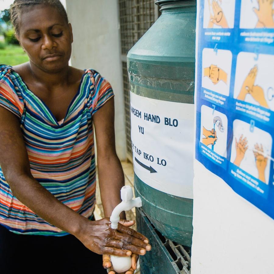 A woman washing her hands in Vanuatu